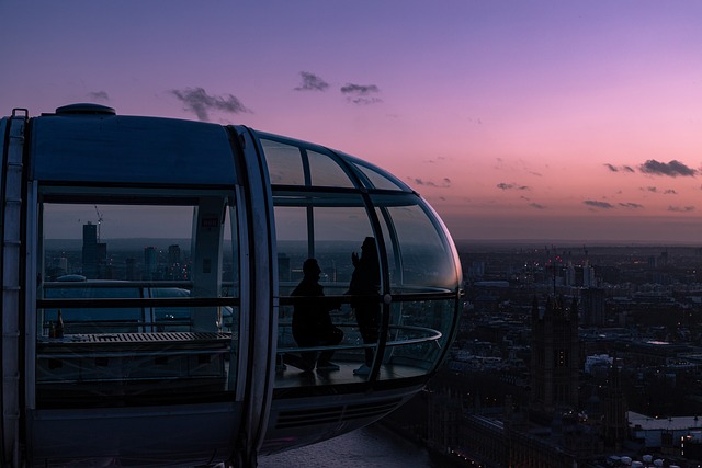 Majestic Ferris wheel against a vibrant sunset